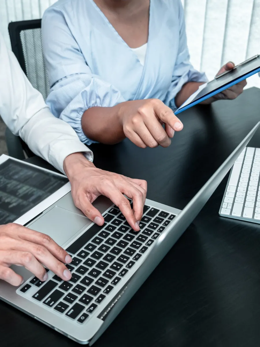 Man and woman completing dark web scan of their systems