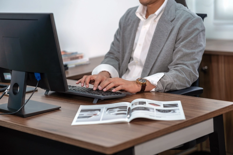 closeup-asian-businessman-in-formal-suit-typing